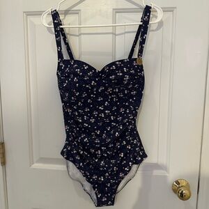 Nip tuck swim. Navy blue with tiny flowers.